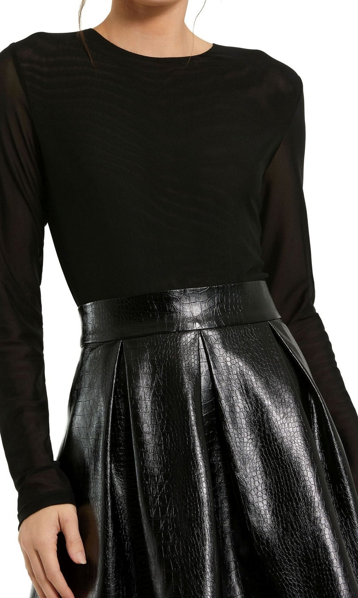 A person wearing the Sleeved Short Black Dress 81070 by Mac Duggal, featuring long sleeves and a textured, high-waisted black leather skirt.